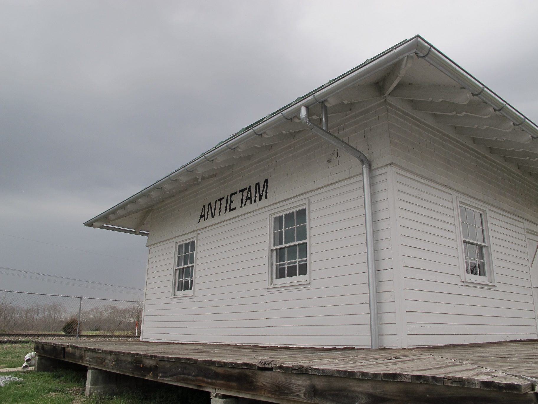 Antietam Station, a white building made out of wood with the letters "ANTIETAM" painted in black ink.