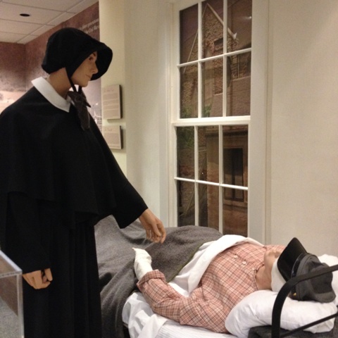 Two figures depict a hospital scene in "Charity Afire," the Civil War exhibit at the Seton Shrine.