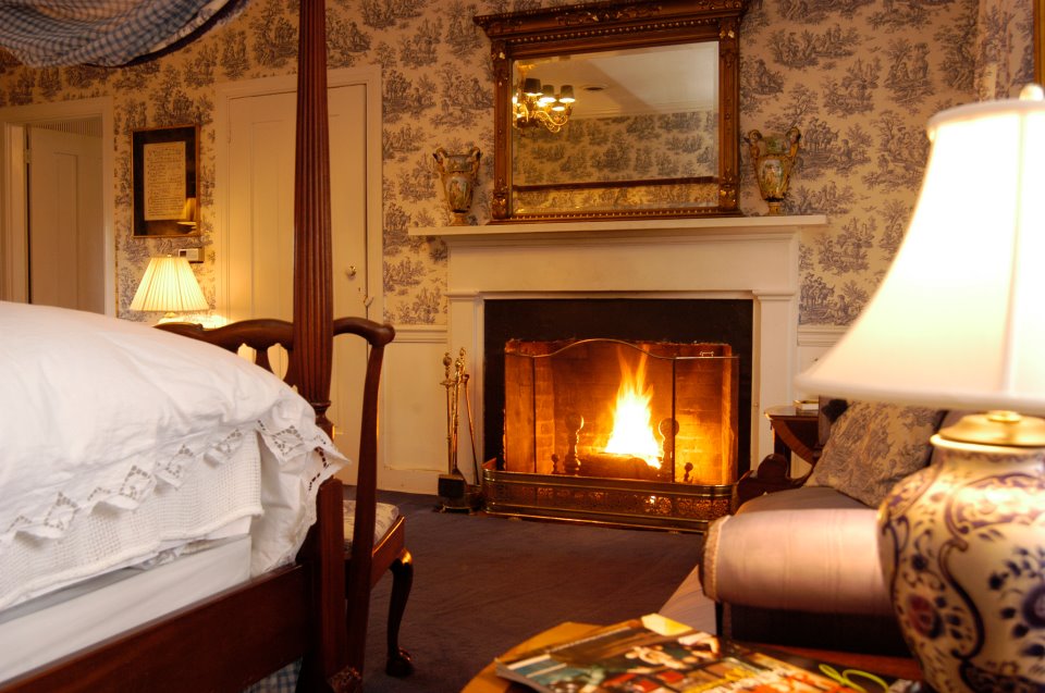 A roaring fire warms a room at the Antrim Country House Hotel
