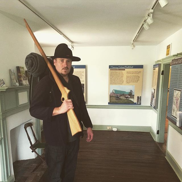A visitor poses in reproduction Civil War clothing at the historic Newcomer House.