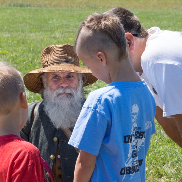 A young boy meets a living historian at Monocacy National Battlefield